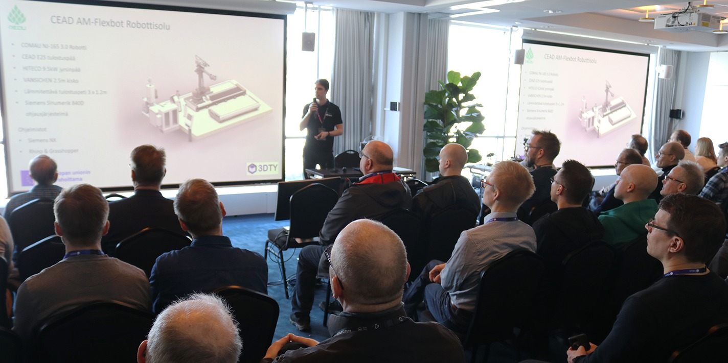 Severi Salmirinne presenting the use of algorithmic design in 3D printing to a packed audience.